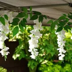 Mason & Jones - Solar Specialists Solar Powered 180cm Artificial Leaf Garland With Wisteria Flowers - Warm White -Garden Furniture Shop 379258 180cm solar powered artificial leaf garland with wisteria flowers 20 warm white micro leds